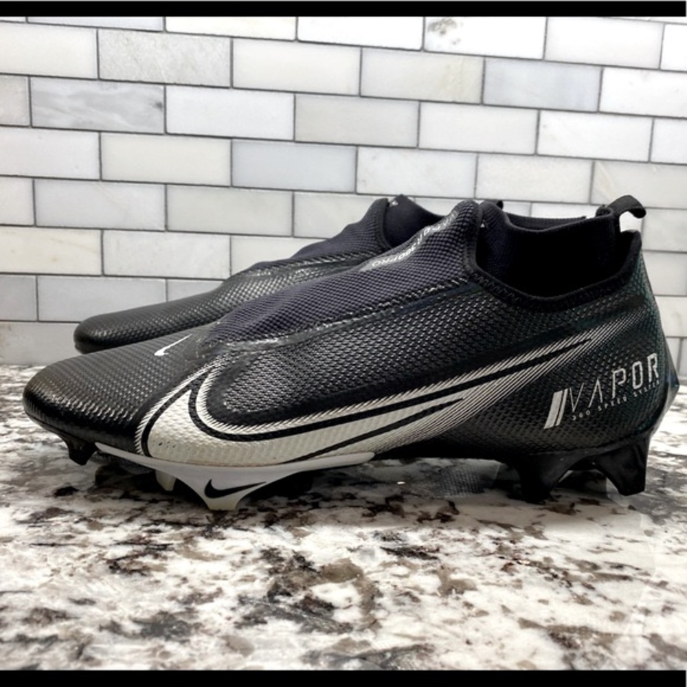 Nike Vapor size 14 black and white soccer cleat with hidden ghost laces.
